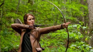 Jennifer Lawrence wields her weapon of choice in The Hunger Games.