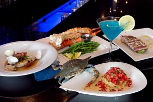 EATS A live blue crab crawls up to say hello to a crabcake of his fallen brothers, surrounded by pan-seared red snapper, Alaskan king crab, jumbo snow crab claws, and an Electric Blue Martini. Tony Robles
