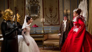 Lily Collins faces off with Julia Roberts with Nathan Lane looking on in Mirror Mirror.