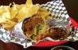 You’ll need a knife and fork to get at Mojo’s pulled pork burrito. Bonnie Mays