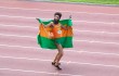 Sacha Baron Cohen does a victory dance with his nation’s flag in The Dictator.