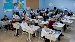 Mohamed Fellag (standing) takes over this group of kids in Monsieur Lazhar.