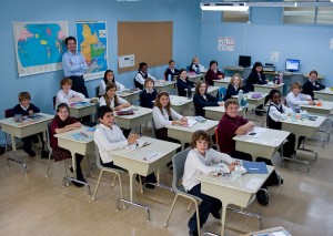 Mohamed Fellag (standing) takes over this group of kids in Monsieur Lazhar.