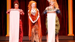 Ava Pine (center) presides while Ashley Kerr and Alissa Anderson proclaim their celibacy pledge in Fort Worth Opera’s production of Lysistrata.