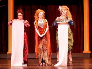STAGE Ava Pine (center) presides while Ashley Kerr and Alissa Anderson proclaim their celibacy pledge in Fort Worth Opera’s production of Lysistrata.
