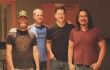 Producer Mike Garcia (far right) and the Oil Boom guys (from left to right: Steve Steward, Ryan Taylor, and Dugan Connors) pause at Fort Worth Sound, where Oil Boom recently recorded six songs.