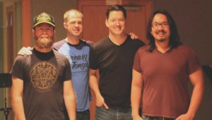 Producer Mike Garcia (far right) and the Oil Boom guys (from left to right: Steve Steward, Ryan Taylor, and Dugan Connors) pause at Fort Worth Sound, where Oil Boom recently recorded six songs.