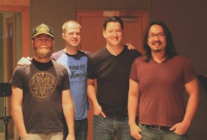 Hearsay Producer Mike Garcia (far right) and the Oil Boom guys (from left to right: Steve Steward, Ryan Taylor, and Dugan Connors) pause at Fort Worth Sound, where Oil Boom recently recorded six songs.