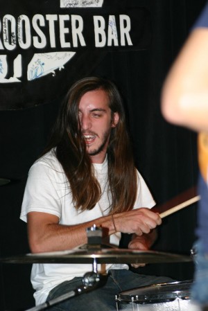 drummer DRUMMERS ALWAYS SEEM TO HAVE COOL HAIR TO TOSS AROUND WHILE BANGING ON THE SKINS.