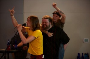 MUSIC-1 Best drummer Matt Mabe throws up the horns as Nick Choate catches a ride with Michael “Big Mike” Richardson, whose Box of Rock won best cover/tribute band. Vishal Malhotra