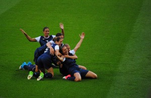 7751372000_9572617586 The U.S. women's soccer team celebrates after their first goal in the 2012 Olympic final.