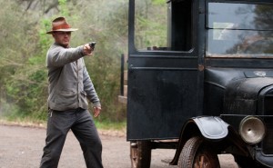 FILM Tom Hardy takes aim in the climactic shootout in Lawless.