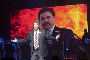 campaign Will Ferrell poses in front of a negative ad aimed at Zach Galifianakis in "The Campaign."