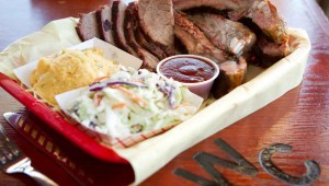 Pork ribs and brisket liven up this two-meat plate at Woody Creek. Tony Robles