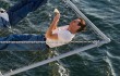 Joaquin Phoenix lounges on an aircraft carrier in The Master.