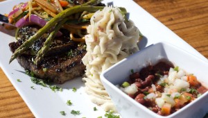 Buffalo West serves up a wonderfully plated 12-oz. rib-eye with mashed potatoes, field greens, and sautéed veggies. Chase Martinez