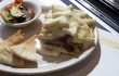 Mixed veggies and pita bread accompany a serving of pastitsio at The Vine. Chase Martinez