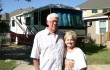 Richard and Ginger Moore are living in the recreational vehicle behind them. Jeff Prince