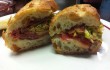 The cherry-wood smoked bacon, prosciutto, and Eagle Mountain gouda sandwich is available at Magnolia Cheese Company.