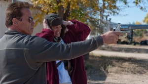 Arnold Schwarzenegger and Johnny Knoxville handle a big-ass gun in The Last Stand.