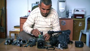 Emad Burnat examines 5 Broken Cameras at Thin Line Film Fest.