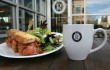 Ryan’s has a smoked salmon sammy and house salad — and a cup of Joe — wih your name on it. Or, at least, their name. Lee Chastain