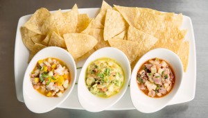 Waters’ ceviche trio, with shrimp, striped bass, and ahi tuna, awaits. Adrien P. Maroney
