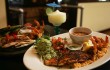 Don Mario’s serves up their Ultimate Fajitas (left) and a platter of catfish and shrimp. Lee Chastain
