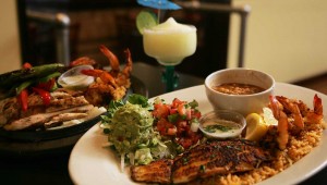 Don Mario’s serves up their Ultimate Fajitas (left) and a platter of catfish and shrimp. Lee Chastain