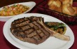 The steaks are cut on-site — and then cooked to order, like this bone-in rib-eye. Lee Chastain