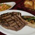 The steaks are cut on-site — and then cooked to order, like this bone-in rib-eye. Lee Chastain