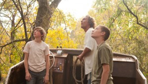 Tye Sheridan, Matthew McConaughey, and Jacob Lofland are up a tree (in a boat) in Mud.