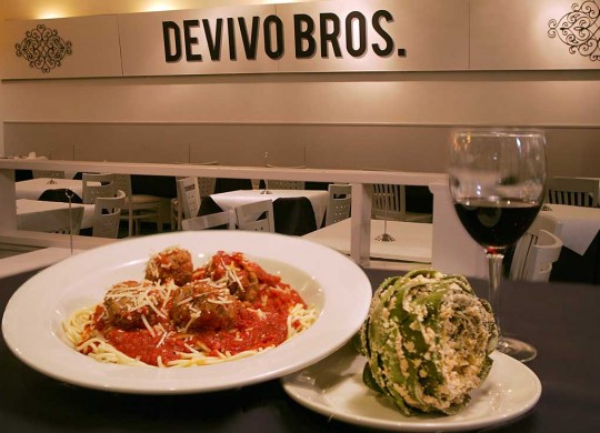 Funky and chunky: DeVivo’s spaghetti and meatballs keep company with a stuffed artichoke. Lee Chastain