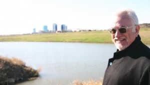 ARCHITECT KEN SCHAUMBURG AT THE SITE OF THE PLANNED APARTMENTS (photo by Jeff Prince).