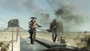 Johnny Depp and Armie Hammer try to catch up with the bad guys’ train car in The Lone Ranger.