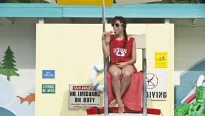 Aubrey Plaza sucks on a push pop while preparing to go through the items on "The To Do List."