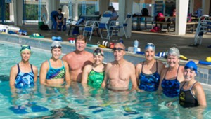Cannell (third from right) got her swim team involved in water safety education. Left to right: Terry Woods, Elaina Rowe, Coach Chuck Burr, Sarah Mountjoy, Roger Yates, Cannell, Julie Jackson and Michelle Brannan. Brian Hutson