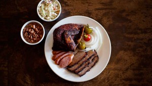 Chicken, sausage, and sliced brisket make a fine plate at the Back Forty Smokehouse. Adrien P. Maroney