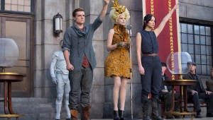 Josh Hutcherson and Jennifer Lawrence flank Elizabeth Banks and say goodbye to District 12 in The Hunger Games: Catching Fire.