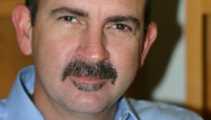 THE MAN, THE MYTH, THE MUSTACHE: MICHAEL NEWQUIST LEADS BY HAIRY EXAMPLE.