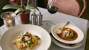 Sera’s Moroccan stew (right) is accompanied by Calasparra rice with veggies and cheese. And a glass of wine. Lee Chastain