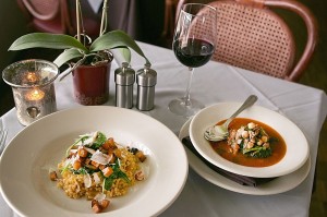 EATS Sera’s Moroccan stew (right) is accompanied by Calasparra rice with veggies and cheese. And a glass of wine. Lee Chastain
