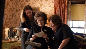 Julianne Nicholson, Meryl Streep, and Margo Martindale consult their family history in August: Osage County.