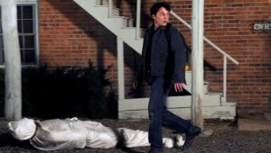 Anton Yelchin tries to get rid of a package that someone else left at his apartment in Odd Thomas.