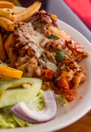 EATS Smartly spiced Tex-Mex goodies, including shrimp skewers, are plentiful at Mariscos la Marea. James Coreas
