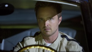 Aaron Paul focuses behind the wheel in Need for Speed.
