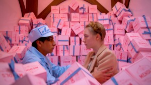 Surrounded by pastry boxes, Tony Revolori and Saoirse Ronan fall in love at The Grand Budapest Hotel.