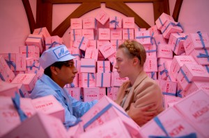 FILM Surrounded by pastry boxes, Tony Revolori and Saoirse Ronan fall in love at The Grand Budapest Hotel.