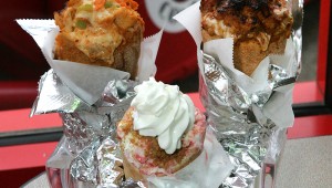 Strawberry cheesecake in a cone (center) isn’t all that surprising, but buffalo chicken (left) and pulled pork make a major statement at Epic Cones. Lee Chastain