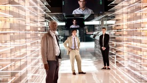 Johnny Depp (on monitors) welcomes Morgan Freeman, Cillian Murphy, and Rebecca Hall to his afterlife in Transcendence.